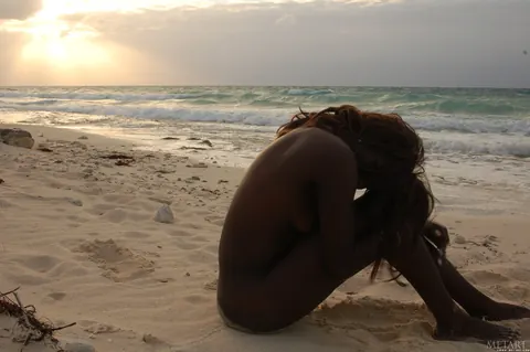 Slim Ebony Redhead Undresses and Poses Nude on the Beach – photo 18 of 21