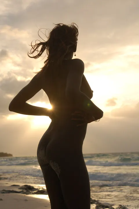 Slim Ebony Redhead Undresses and Poses Nude on the Beach – photo 15 of 21