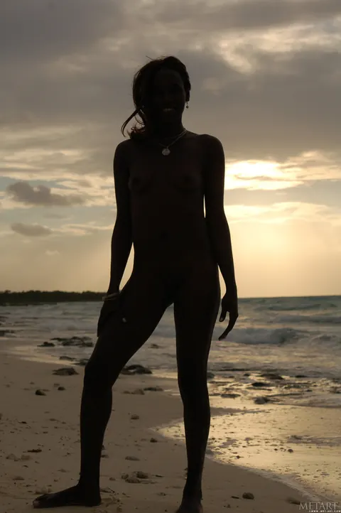 Slim Ebony Redhead Undresses and Poses Nude on the Beach – photo 3 of 21