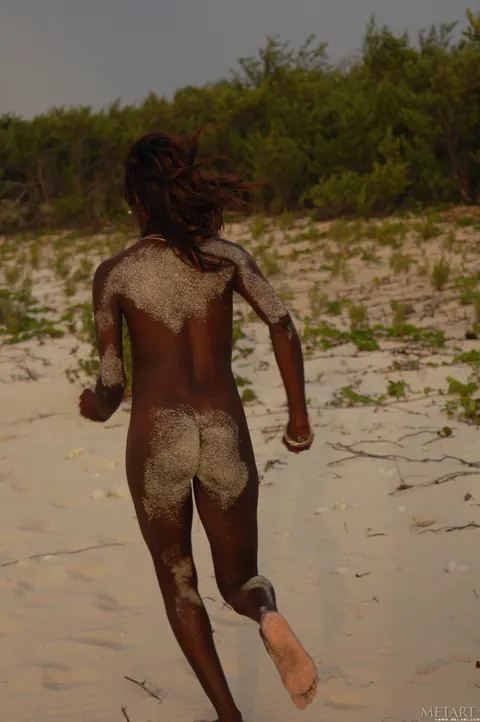 Slim Ebony Redhead Undresses and Poses Nude on the Beach – photo 20 of 21