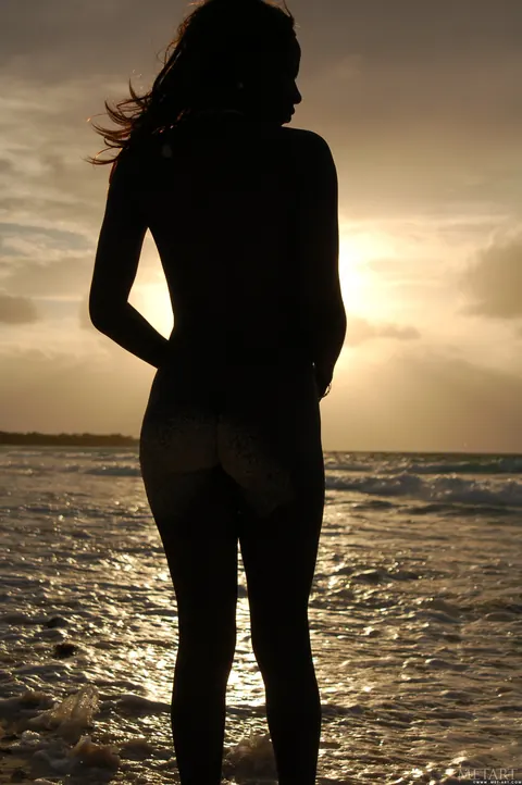 Slim Ebony Redhead Undresses and Poses Nude on the Beach – photo 10 of 21