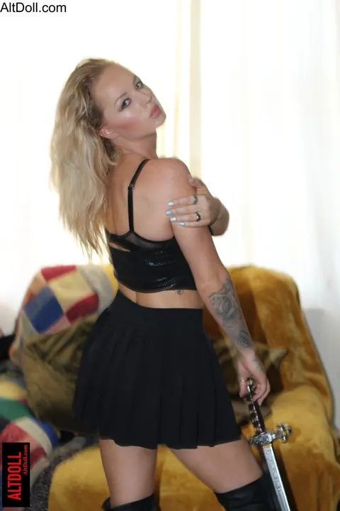 Tattooed Blonde MILF Poses in Boots and Skirt – photo 15 of 15