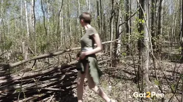 In a Forest, a Short-Haired European Woman Pisses and Spreads