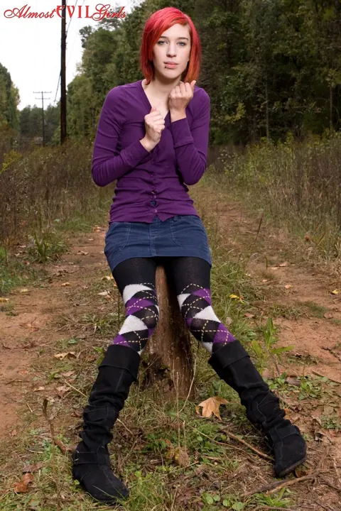 Redhead Pulls Pantyhose Aside to Show Her Pussy on a Stump – photo 8 of 15