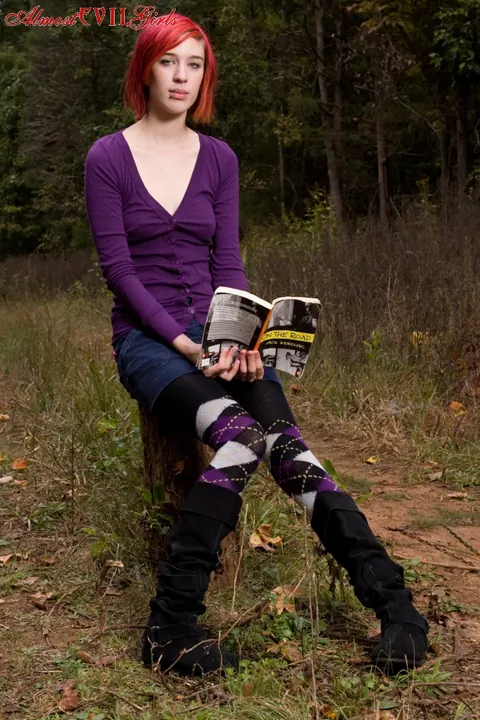 Redhead Pulls Pantyhose Aside to Show Her Pussy on a Stump – photo 1 of 15