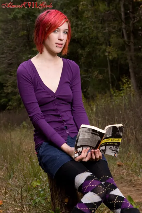 Redhead Pulls Pantyhose Aside to Show Her Pussy on a Stump – photo 2 of 15