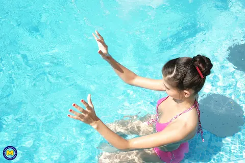 Mature Women Rim Each Other in Bikinis by the Pool – photo 2 of 21