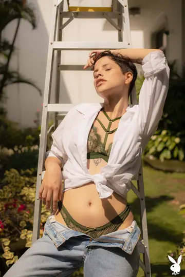 Short-Haired Latina Shows Enhanced Tits and Tattoo Outdoors