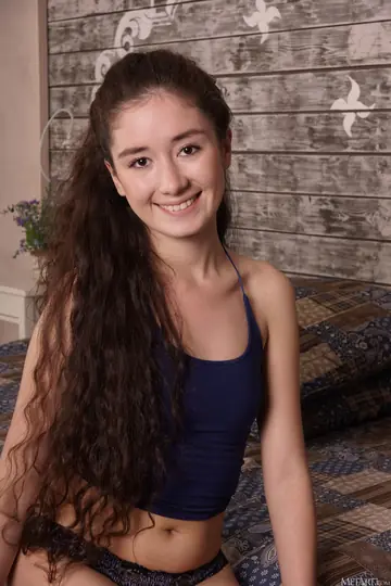Woman Undresses and Displays Her Hairy Pussy