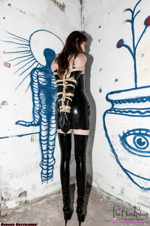 Fetish Model in a Latex Skirt and Stockings Is Restrained – photo 5 of 16