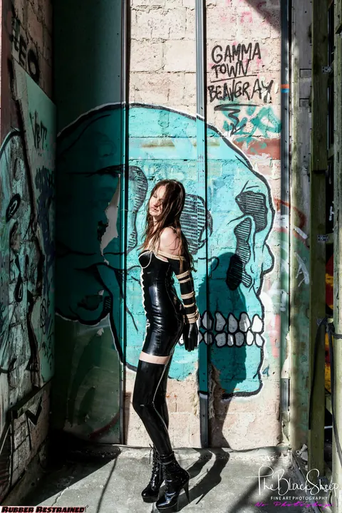 Fetish Model in a Latex Skirt and Stockings Is Restrained – photo 11 of 16
