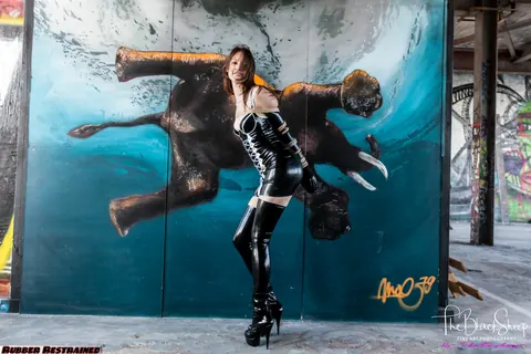 Fetish Model in a Latex Skirt and Stockings Is Restrained – photo 7 of 16
