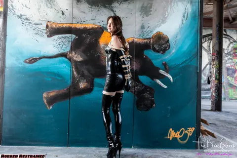 Fetish Model in a Latex Skirt and Stockings Is Restrained – photo 1 of 16
