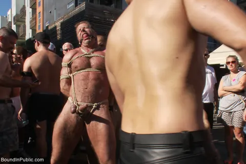 Two Men Bound and Nude in a Public Outdoor Setting – photo 14 of 21