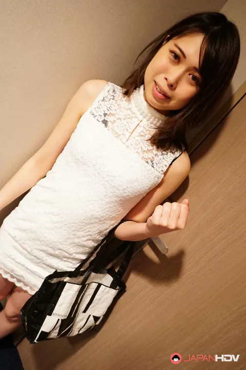 Petite Japanese Brunette Crosses Her Legs After a Skirt Tease – photo 1 of 15
