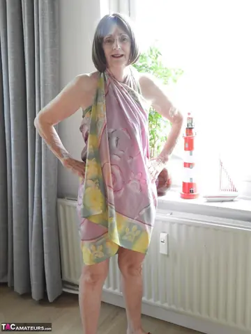 Brunette with Short Hair Removes Her Bikini and Skirt to Spread Her Pussy