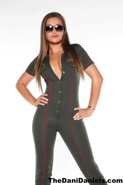 Dani Daniels: Busty Brunette Strips Out of Her Flight Uniform in Heels – photo 2 of 15