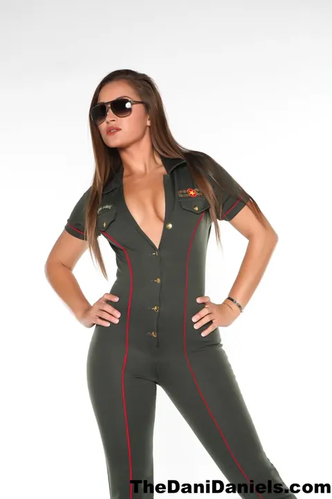 Dani Daniels: Busty Brunette Strips Out of Her Flight Uniform in Heels – photo 4 of 15