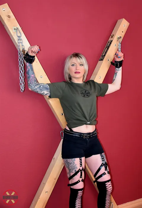 Tattooed Blonde Bound to Cross with Ball Gag in Shorts – photo 9 of 16
