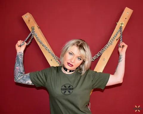 Tattooed Blonde Bound to Cross with Ball Gag in Shorts – photo 2 of 16
