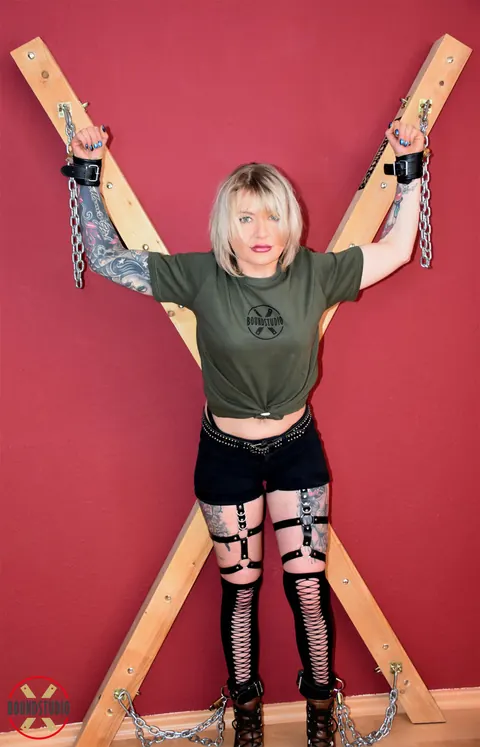 Tattooed Blonde Bound to Cross with Ball Gag in Shorts – photo 13 of 16
