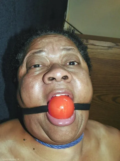 Curvy Mature Ebony Woman Endures Strict Hogtie and Ball Gag – photo 6 of 16