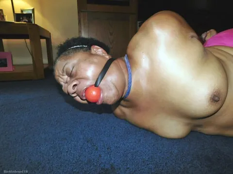 Curvy Mature Ebony Woman Endures Strict Hogtie and Ball Gag – photo 1 of 16
