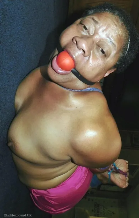 Curvy Mature Ebony Woman Endures Strict Hogtie and Ball Gag – photo 13 of 16