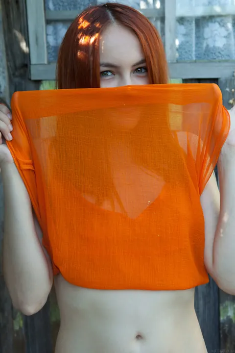 Redhead Pulls Her Panties Aside and Spreads Outdoors – photo 13 of 21