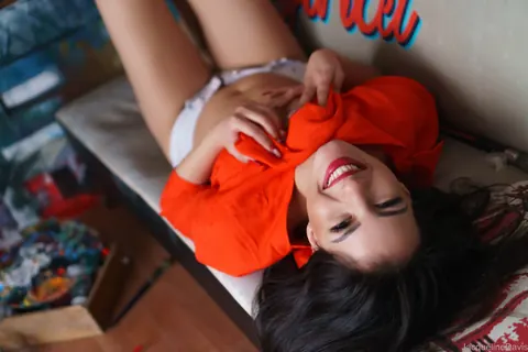 Jacqueline Davis: Brunette in Glasses and Shorts Flashes Her Small Tits – photo 15 of 15