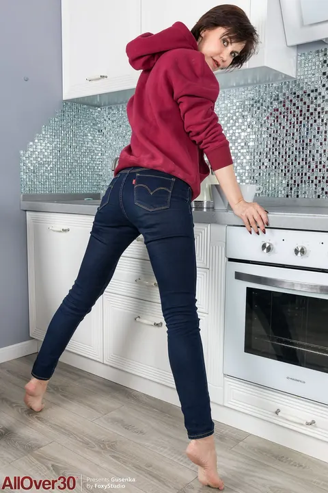 Busty Brunette MILF Strips Off Her Jeans and Masturbates in the Kitchen – photo 3 of 21