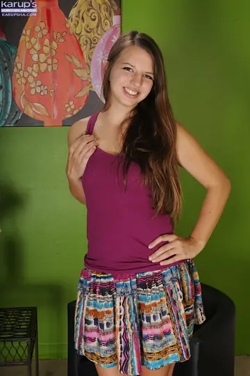 Busty Woman Strips Out of Her Skirt and Spreads Her Shaved Pussy