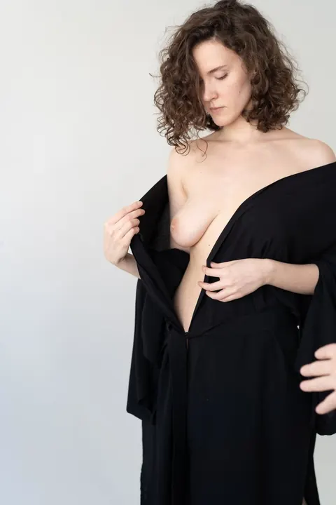 Slim Curly Brunette Undresses and Shows Her Tits – photo 8 of 21