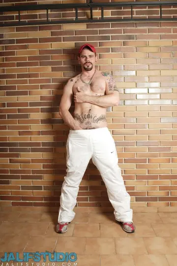Tattooed Hairy Man Strokes His Cock