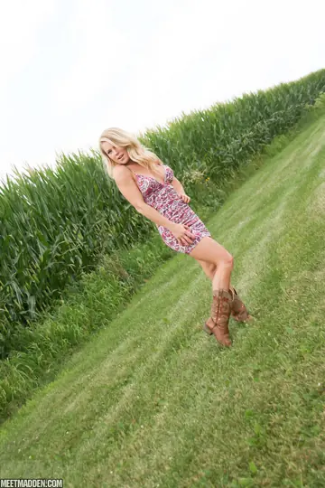 Meet Madden – Slim Blonde MILF Strips Out of Her Skirt by the Fence