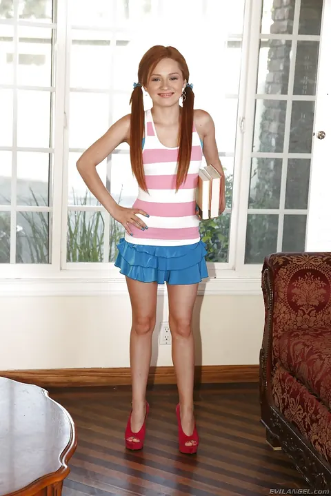 Jennifer Anderson: Slim Redhead in Pigtails Strips Off Her Skirt and Spreads Her Legs – photo 4 of 16