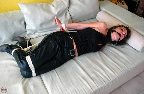 Blonde in Leather Pants and High Heels Hogtied and Gagged – photo 2 of 16