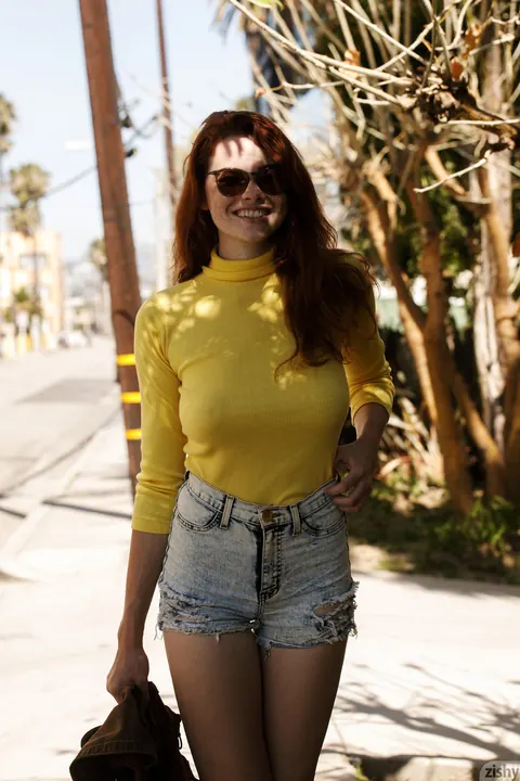 Sabrina Lynn: Tall Redhead in Glasses Teases Her Hard Nipples Through Sweater Outdoors – photo 1 of 12