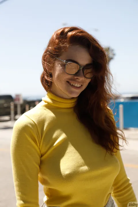 Sabrina Lynn: Tall Redhead in Glasses Teases Her Hard Nipples Through Sweater Outdoors – photo 11 of 12