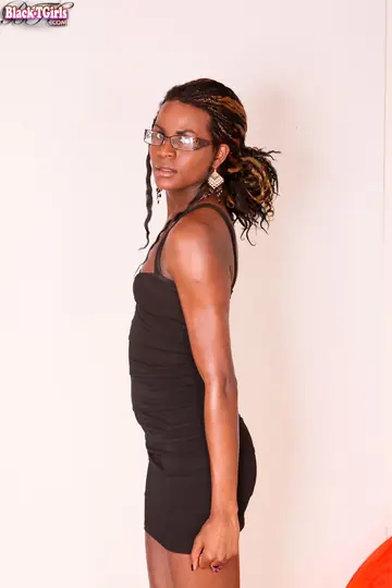 Ebony Trans Woman Strips Nude and Poses Displaying Her Hard Cock