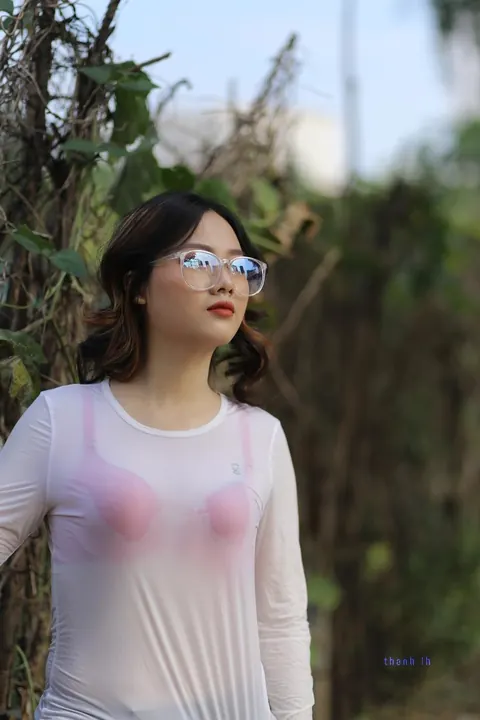 Curly Asian Woman Poses Outdoors in Glasses – photo 5 of 21