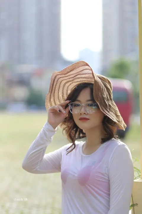 Curly Asian Woman Poses Outdoors in Glasses – photo 13 of 21