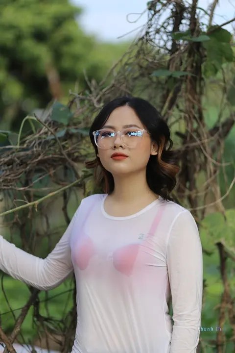 Curly Asian Woman Poses Outdoors in Glasses – photo 2 of 21