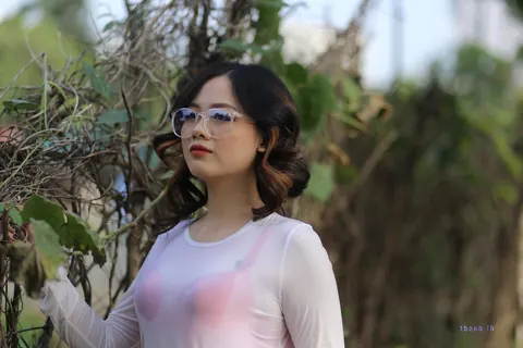 Curly Asian Woman Poses Outdoors in Glasses – photo 8 of 21