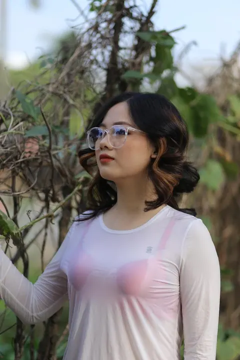 Curly Asian Woman Poses Outdoors in Glasses – photo 10 of 21