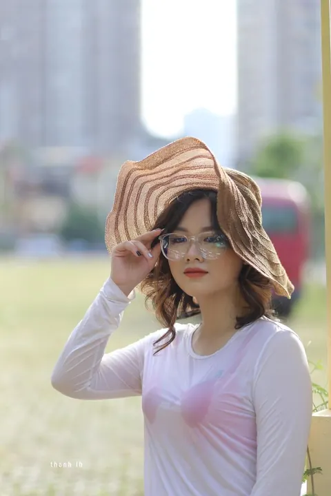Curly Asian Woman Poses Outdoors in Glasses – photo 14 of 21