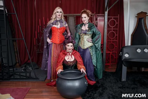 Audrey Madison: Blonde and Redhead MILFs in Costumes Dominate a Man in a Group – photo 2 of 21