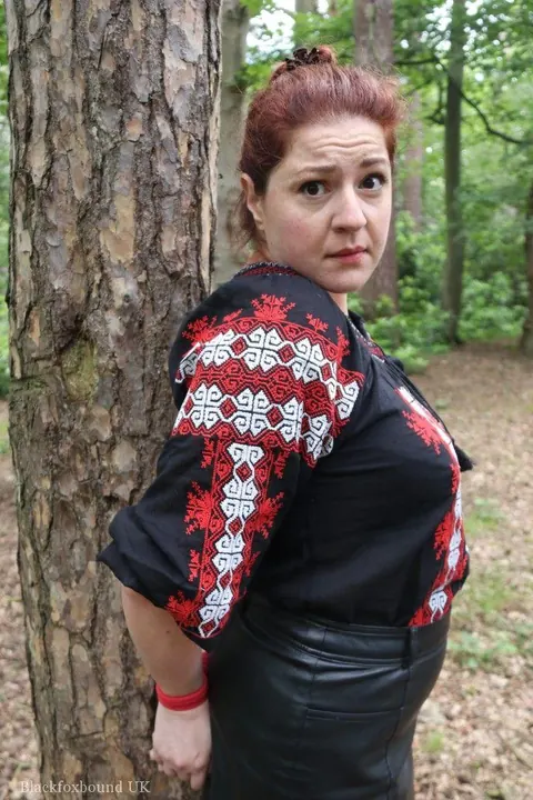 Thick Redhead in a Skirt and Leather Bound to a Tree – photo 3 of 16