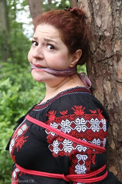 Thick Redhead in a Skirt and Leather Bound to a Tree – photo 14 of 16