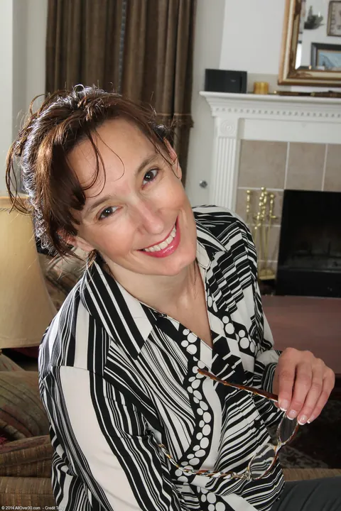 Celeste Carpenter: Brunette MILF Strips Off Her Stockings and Fingers Her Pussy – photo 1 of 20